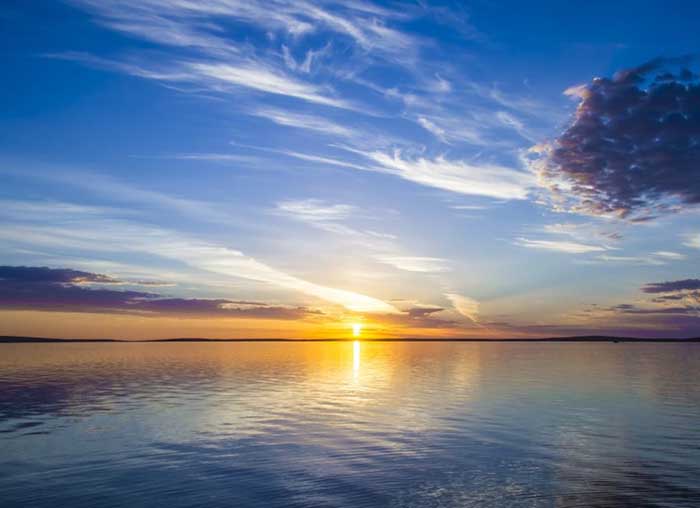 sunset on horizon of ocean
